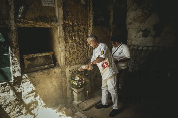 Giovanni Yanez (59) and his woman Manuela Fernández (43) mourn the death of their daughter Rusmary Katiuska Aguilar Fernández, who was shot dead by security forces, Cementerio del Sur, Caracas, Venezuela, South America