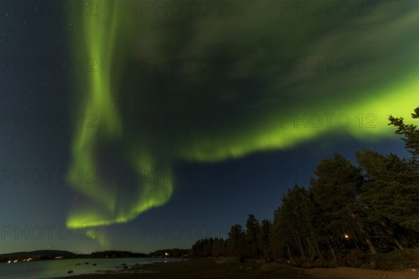 Northern lights, (Aurora borealis) at a lake near Kiruna, September 2024, Lapland, Sweden, Europe