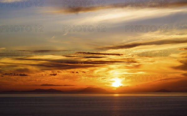 Sunset over Aeolian Islands from Nicotera, Aeolus, Sicily, Tyrrhenian Sea, Italy, Europe