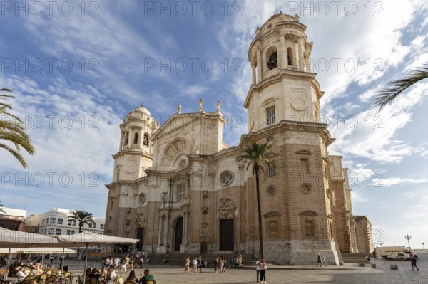 Majestic cathedral with striking towers under a cloudy sky, Cadiz