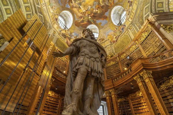 Statue of Emperor Charles VI by Peter and Paul Strudel, State Hall of the Austrian National Library in Vienna, Austria, Europe