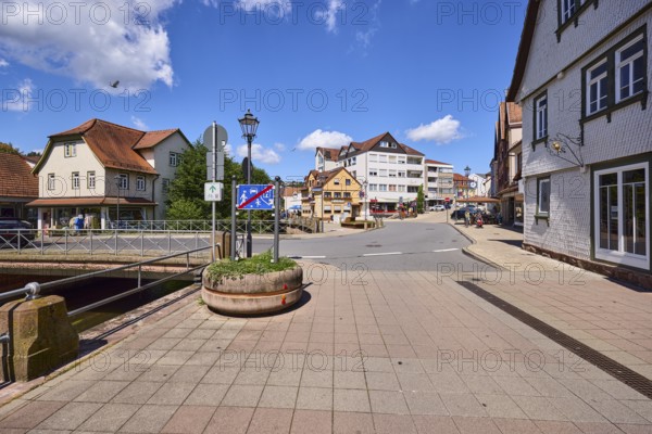 Car and pedestrian bridge, general development, lantern, pavement made of paving slabs, blue sky with cumulus clouds, intersection of main road and Brückenstraße, Erbach, Odenwald, Odenwaldkreis, Hesse, Germany, Europe