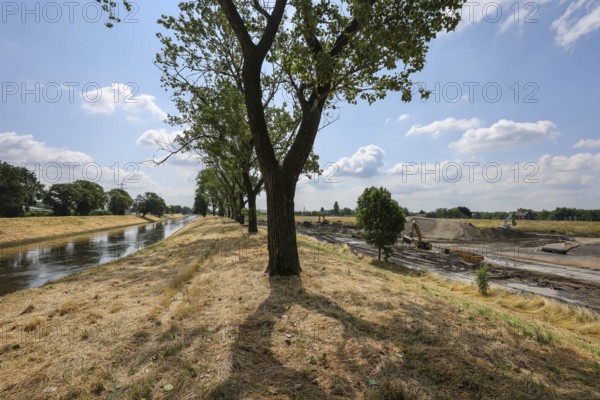 Oberhausen, North Rhine-Westphalia, Germany, renaturalisation of the Emscher in the Holtener Bruch. The currently straightened Emscher, shown here at flood level, has been given curves again and can meander through its new floodplain. The ecological conversion of the Emscher system consists of the construction of a centralised wastewater treatment system in the Ruhr region, the construction of sewers and the renaturation of the Emscher and its tributaries. Following the construction of a parallel sewer, the Emscher has been completely free of sewage since January 2022. The river was previously an open, above-ground combined sewer with rainwater and wastewater, Europe