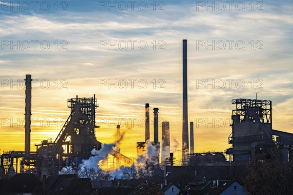 Blast furnace Schwelgern 1 and 2, ThyssenKrupp Steel Schwelgern plant in Duisburg-Marxloh is part of the Bruckhausen steelworks, sunset, North Rhine-Westphalia, Germany, Europe