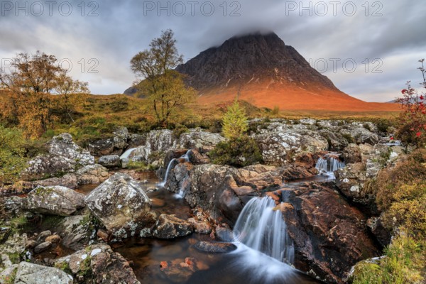 Wild river, waterfall, autumn colours, morning light, mountain landscape, cloudy mood, Buachaille Etive Mòr, Glencoe, Scottish Highlands, Scotland, Great Britain