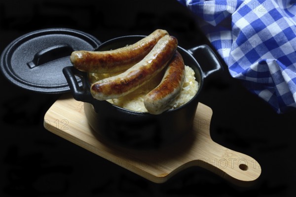 Nuremberg sausages with sauerkraut in a pot, Rostbratwurst, Germany, Europe