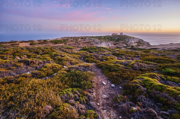 Cabo Espichel cape Espichel on Atlantic ocean at sunset with ruins