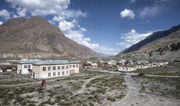 Abandoned ruined buildings in a mountain landscape, ghost town, Engilchek, Tian Shan, Kyrgyzstan, Asia