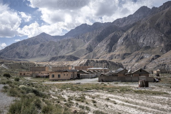 Abandoned ruined buildings in a mountain landscape, ghost town, Engilchek, Tian Shan, Kyrgyzstan, Asia