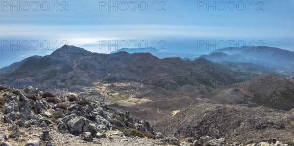 View from the summit of Kali Limno over the rocky mountain landscape of southern Karpathos with the sea under a clear blue sky, hike to the summit of Kali Limni, Kali Limni, Lastos, Karpathos, Greece, Europe