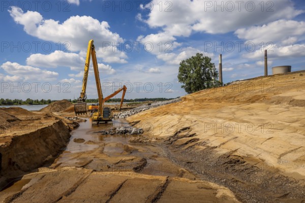 Dinslaken, Voerde, North Rhine-Westphalia, Germany, Emscher estuary into the Rhine. Construction site of the new Emscher estuary in front of the decommissioned STEAG coal-fired power station in Voerde. The mouth of the Emscher into the Rhine is being moved almost 500 metres north from Dinslaken to Voerde. Fish will then be able to swim barrier-free up the new Emscher from the Rhine through a newly created floodplain area. Following the construction of a parallel sewer, the Emscher has been completely free of sewage since January 2022. The river was previously an open, above-ground combined sewer with rainwater and wastewater, Europe