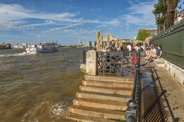 People enjoying the afternoon on the promenade at Travalgar Tavern, Greenwich, London, England, United Kingdom, London, South England, United Kingdom, Europe