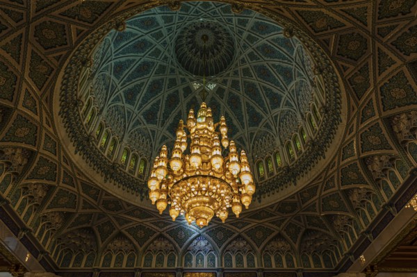 Dome and illuminated chandelier in the Sultan Qaboos Mosque, Muscat, Arabian Peninsula, Sultanate of Oman