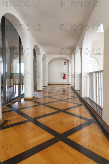 Modern hallway with arches and a striking wooden floor, bright atmosphere, Kirchheim Teck, Germany, Europe