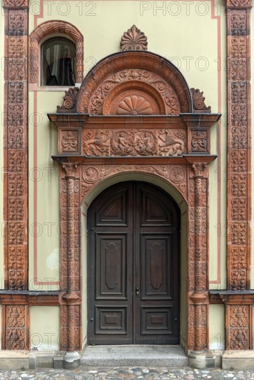 Entrance door in the Italian Renaissance style from 1555, in the inner courtyard of the former Fürstenhof, summer residence of the Dukes of Mecklenburg, today the district court, Vor dem Fürstenhof 1, Wismar, Mecklenburg-Vorpommern