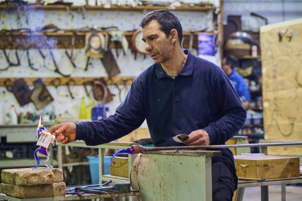 Glassblower at work in Murano, Italy, Europe