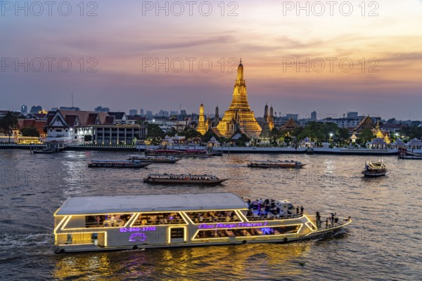 The Buddhist temple Wat Arun or Temple of Dawn and the Chao-Phraya River at dusk, Bangkok, Thailand, Asia