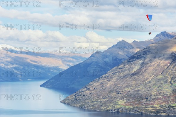 Paragliding over the Remarkables mountain range, Queenstown, South Island, New Zealand, Oceania