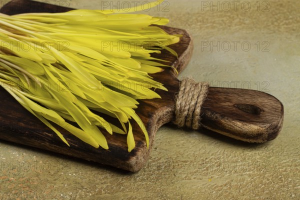 A microgrown corn, a bouquet on a cutting wooden board, no people