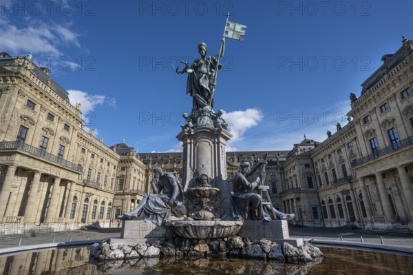 Frankoniabrunnen, neo-baroque, created in 1894, fountain figures and figure of Frankonia with the storm banner, Franconian racing flag in hand, Residenzplatz, Würzburg, Lower Franconia, Bavaria, Germany, Europe