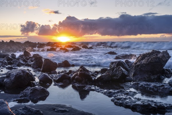 Rocks on the beach of Playa del Inglés. Sunset. Long exposure. Sea and waves. Valle Gran Rey, La Gomera, Canary Islands, Spain, Europe