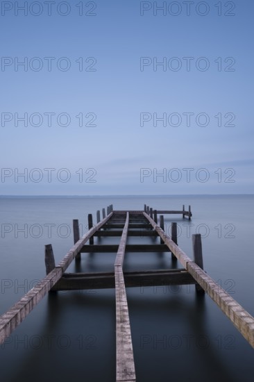 View of a partially dismantled jetty at Steinhuder Meer, long exposure, Wilhelmstein, Hagenburg Canal, lake, nature photo, landscape photography, drifting clouds, portrait format, wood, Hagenburg, Hanover region, Lower Saxony, Germany, Europe