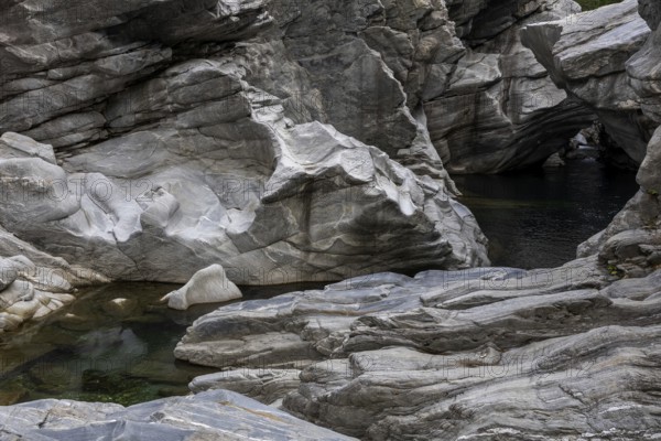 Rocks, granite rock formations in the Maggia River near Ponte Brolla, in the Maggia Valley, Valle Maggia, Canton Ticino, Switzerland, Europe