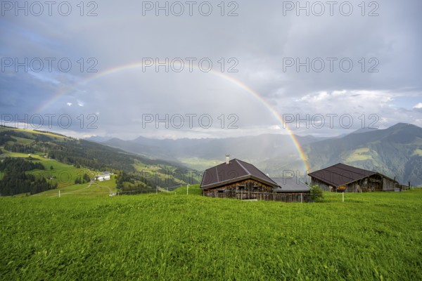 Alpine huts, view over the Brixen Valley with rainbow, Hochbrixen, Brixen im Thale, Kitzbühel Alps, Tyrol, Austria, Europe