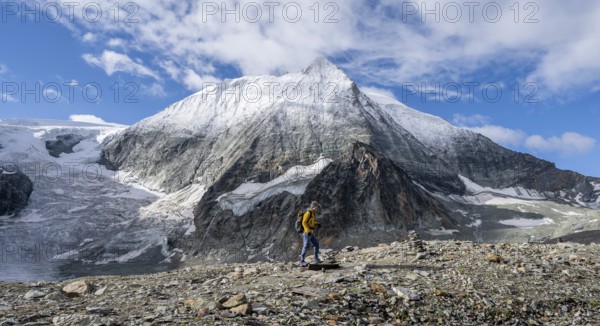 Mountaineer in front of the summit of Mont Blanc de Cheilon and glacier Glacier de Cheilon, Valais Alps, Valais, Switzerland, Europe