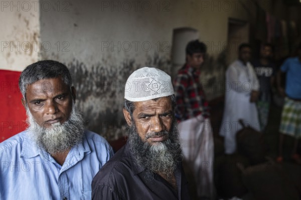 Traders in front of their shop at Sadarghat, river quay at Buriganga, Dhaka, Bangladesh, Asia
