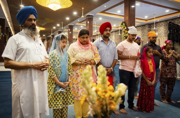 Sikh devotees offer prayers at a Gurudwara on the occasion of Guru Nanak Jayanti, in Guwahati, Assam, India on 15 November 2024. Guru Nanak Jayanti, also known as Gurpurab or Guru Nanak Prakash Utsav, is one of the most significant festivals in Sikhism. It commemorates the birth of Guru Nanak Dev Ji, the founder of Sikhism and the first of the ten Sikh Gurus.