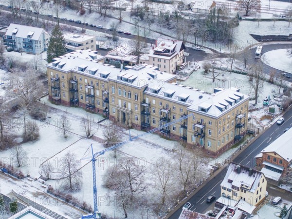 Historic building in the snow, surrounded by a construction site and winter trees, Nagold, Black Forest, Germany, Europe