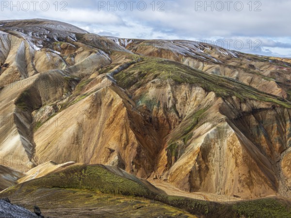 Early snow on the colorful rhyolite mountains, Landmannalaugar, Fjallabak Nature Reserve, Iceland, Europe