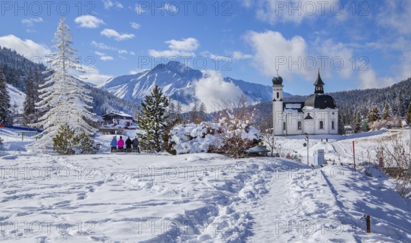 Seekirchl with artificial winter fir tree and Hocheder 2797m in winter, Seefeld, Seefeld Plateau, Tyrol, Austria, Europe