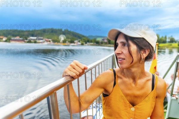 A female tourist on a boat on Lake Titisee in the Black Forest, Germany, Europe