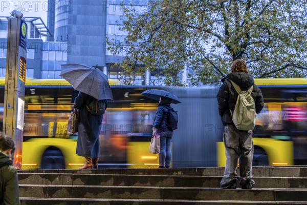 Autumn, rainy weather, bus stop at the central station, passengers waiting for the bus, Essen, North Rhine-Westphalia, Germany, Europe