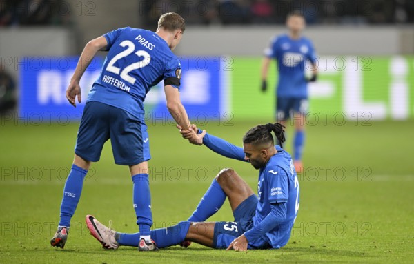 Alexander Prass TSG 1899 Hoffenheim (22) helps Kevin Akpoguma TSG 1899 Hoffenheim (25) to his feet, Europa League, PreZero Arena, Sinsheim, Baden-Württemberg, Germany, Europe