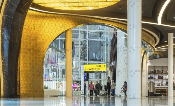 Abu Dhabi Airport, Zayed International Airport with passengers. Duty free shop. The new Terminal A has a capacity of 45 million passengers per year. Modern architecture. Abu Dhabi, United Arab Emirates, UAE, Asia