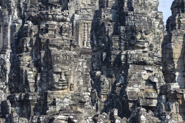 Giant stone-carved faces of the Bodhisattva Lokeshvara, also known as Avalokiteshvara, Bayon Temple, Angkor Thom, UNESCO World Heritage Site, Angkor Wat, Siem Reap, Cambodia, Asia