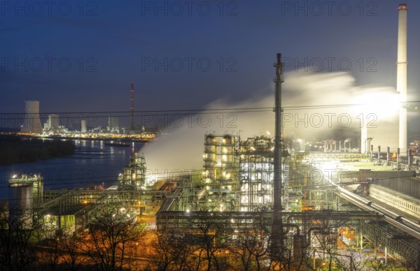 The Schwelgern coking plant supplies over 2.5 million tonnes of coke to Thyssenkrupp Steel's Schwelgern blast furnace plant on the Rhine, considered the most modern coking plant in the world with the world's largest coke oven batteries, on the left the so-called white side, a chemical factory that generates many by-products from the coking process, in the background the STEAG combined heat and power plant Duisburg-Walsum, North Rhine-Westphalia, Germany, Europe