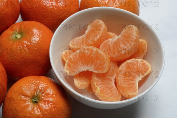 Clementines and clementine pieces in peel, clementine