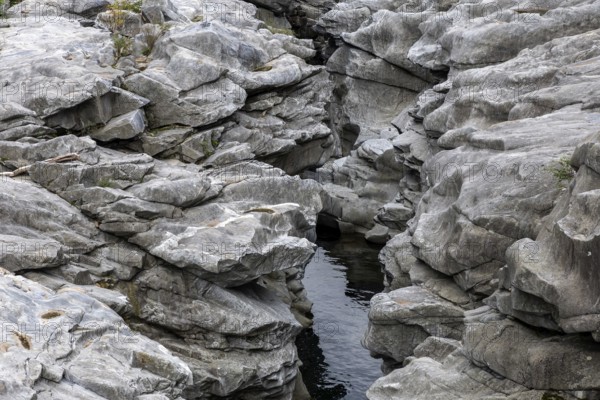 Rocks, granite rock formations in the Maggia River near Ponte Brolla, in the Maggia Valley, Valle Maggia, Canton Ticino, Switzerland, Europe