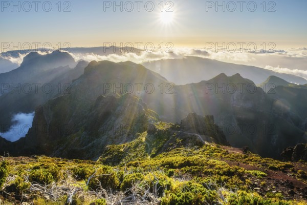 View of mountains over clouds from Pico Ruivo on sunset. Madeira island, Portugal, Europe