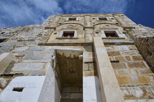 Old historic wall with windows and decorated stone in the sunlight, Querini Castle, Chora, Astypalea, Dodecanese, Greek Islands, Greece, Europe