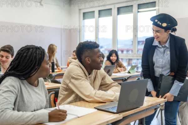 Multi ethnic students listening to their teacher during a lesson in a classroom at the university