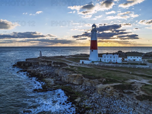 Sunset over Portland Bill Lighthouse from a drone, Portland Bill, Isle of Portland, Dorset, England, United Kingdom, Europe