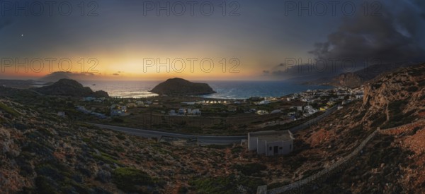 Atmospheric dusk with a view of the coast and town of Arkasa and the sea in the background, Arkasa, Karpathos, Greece, Europe