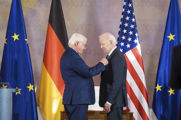 Joe Biden (46th President of the United States) receives the special grade of the Grand Cross from Frank-Walter Steinmeier (President of the Federal Republic of Germany) at Bellevue Palace, Berlin, 18 October 2024