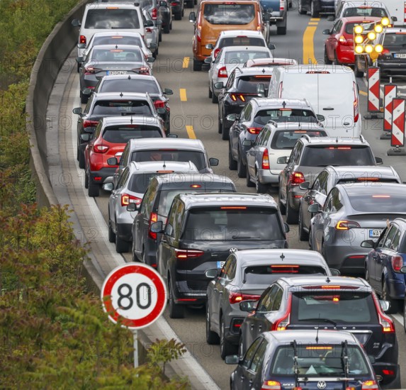 Duisburg, North Rhine-Westphalia, Germany, traffic jam on the A40 motorway at the Kaiserberg junction. The busy area with the A40 and A3 motorways has been undergoing renovation and expansion for years. There are always closures or restrictions for motorists there, Europe