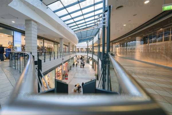 Elongated aisle in a modern shopping centre under a glass roof, Sterncenter Sindelfingen, Böblingen district, Germany, Europe